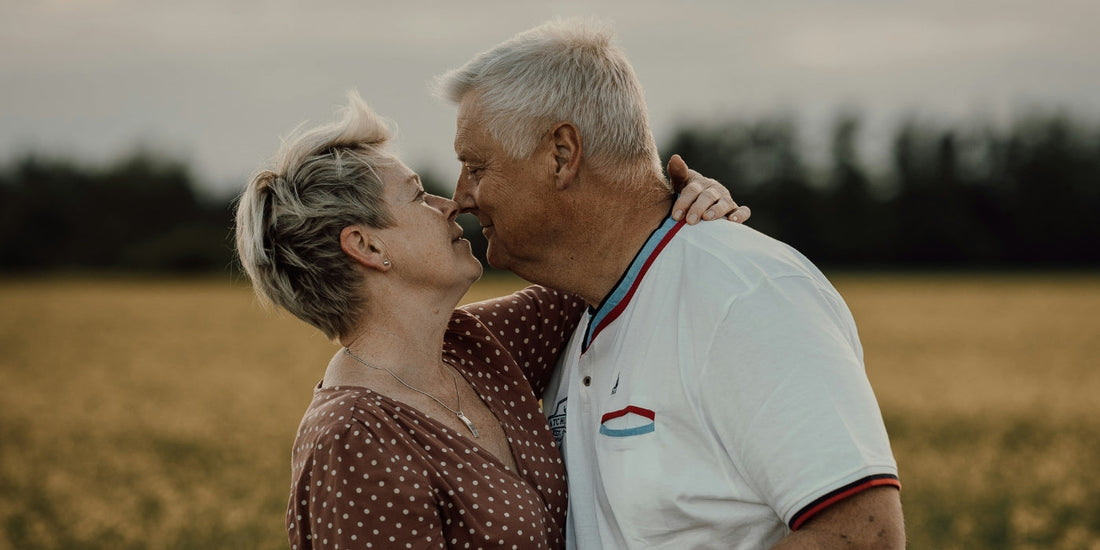 Couple kissing in  yellow field