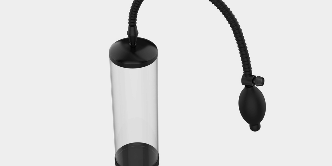 A glass tube for a penile pump, featuring a black and white corded plug attached to its side.