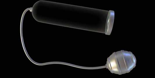 A photo of a grey Vacuum Penis Pumps for Men in a black background. 