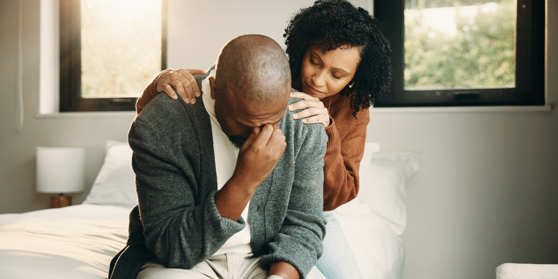 Wife comforting her husband as he feels frustrated with erectile dysfunction treatment.