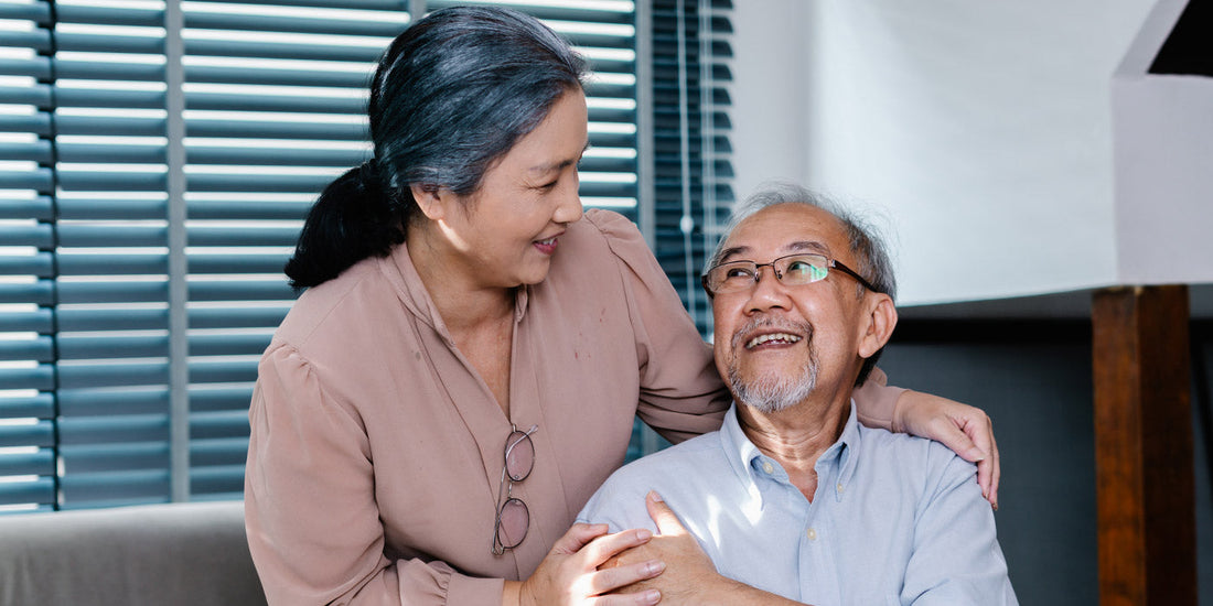 Elderly couple cuddling