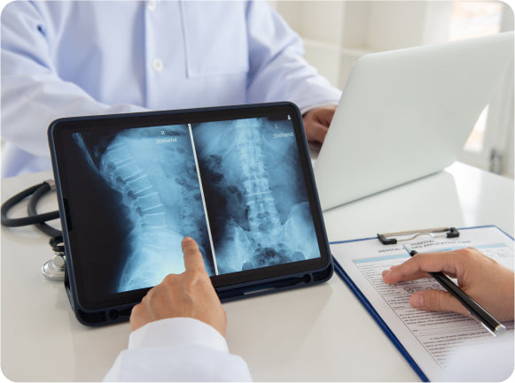 A doctor showing a patient an x-ray