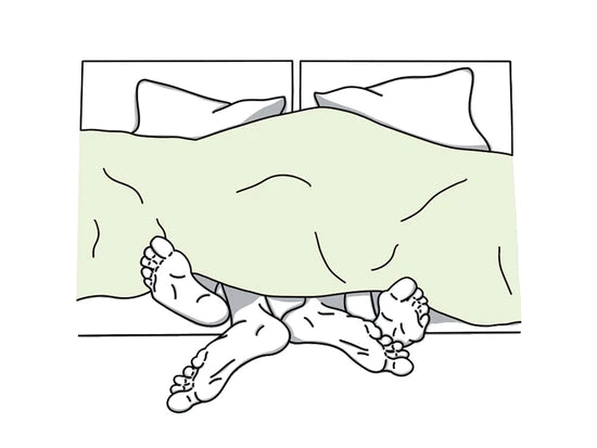 Feet hanging out of blanket